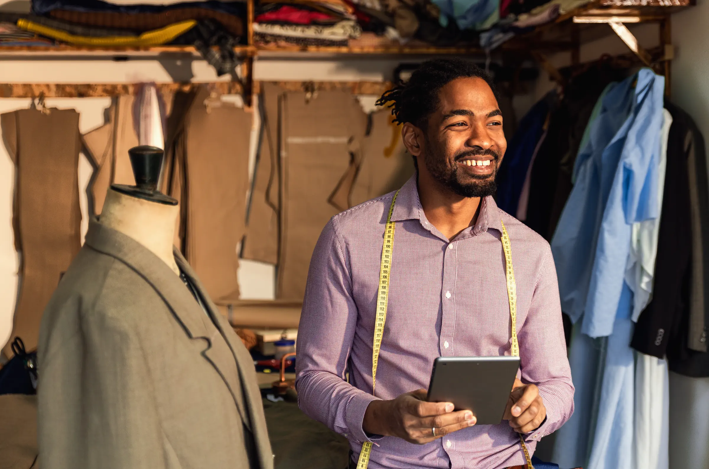 Portrait of a male tailor using a tablet